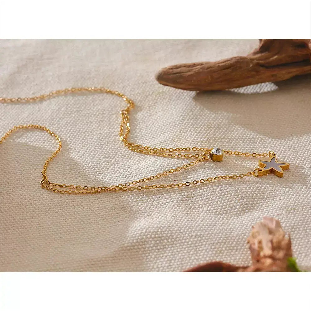 Colar Feminino Bela Estrela,
colar duplo feminino,
colar de concha natural,
colar com estrela e zircônia,
colar dourado em aço inoxidável,
colar elegante e sofisticado,
acessórios femininos de luxo,
colar para presentear